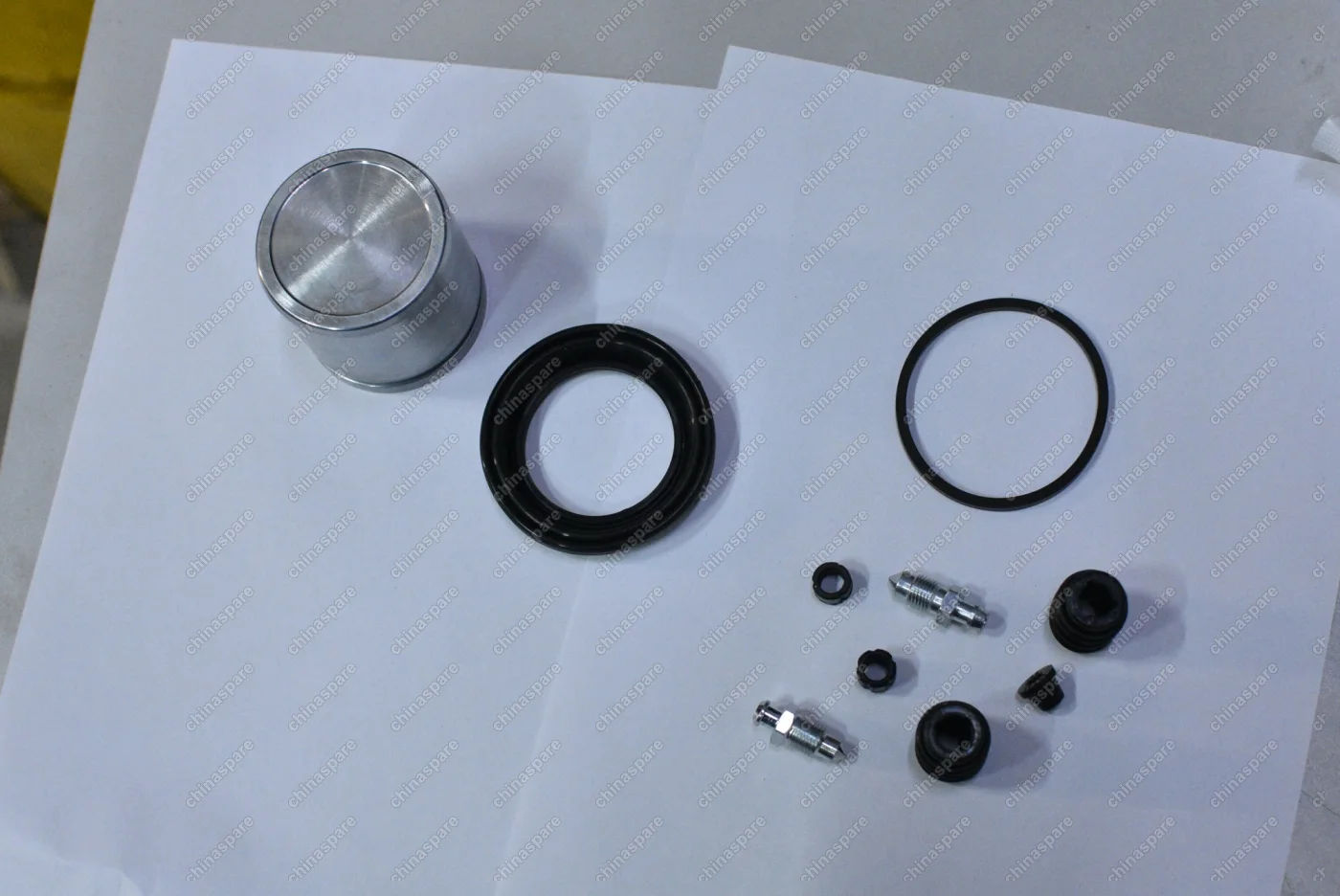 Ремкомплект переднего суппорта (Поршень, манжеты) Chery Fora, Tiggo