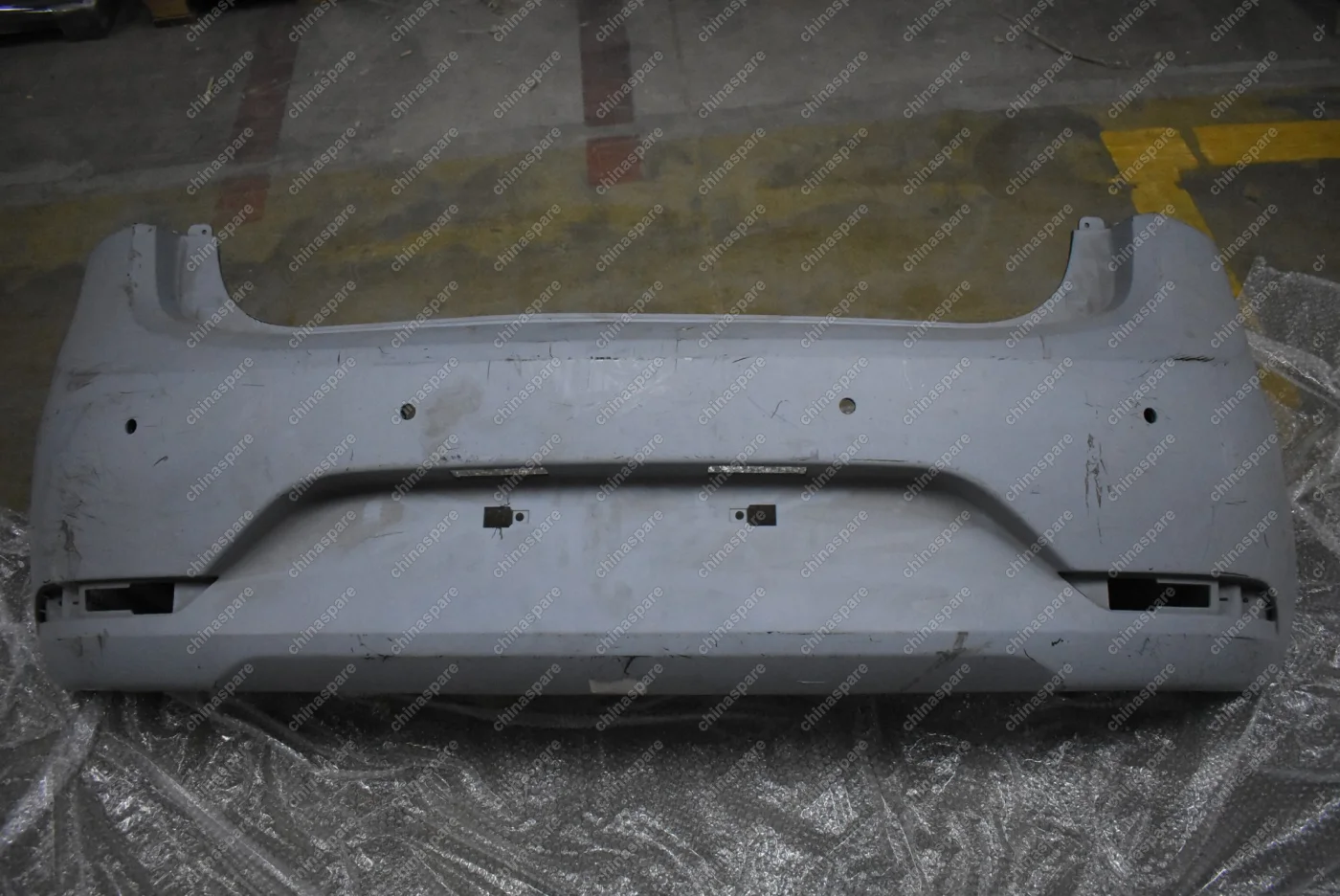 Бампер задний Kia Rio 2011-2017 (грунт, под парктроник, уценка)