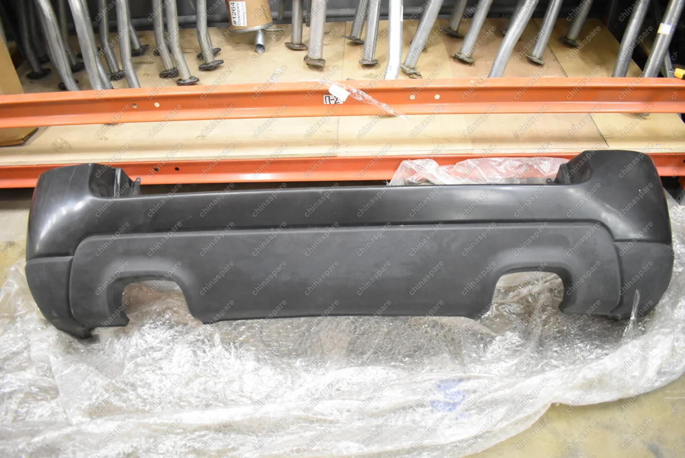 Бампер задний Kia Sportage 2004-2010 (под 2 трубы, без парктроника) (Уценка)