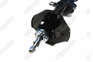 Амортизатор передний левый Trialli Geely Emgrand